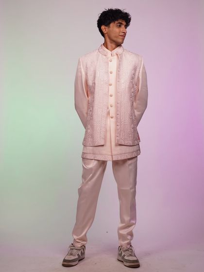 Another look at the pastel pink Indo-Western set, showing its full silhouette and unique layered design.