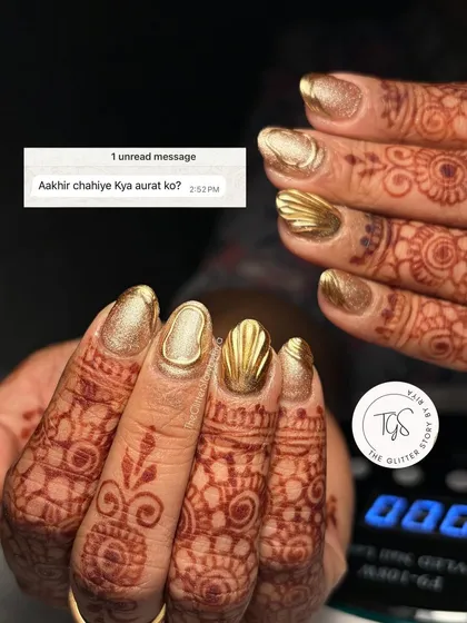A fun take on what women want: beautiful nails. This shot showcases a stunning 3D textured gold chrome set, perfect for a bride or wedding guest.