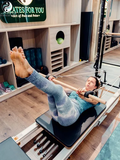 The perfect way to beat the Monday blues. This exercise on the reformer uses the push-through bar to stretch the hamstrings and spine, promoting length and relaxation.