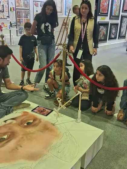 We often invite established artists to host special sessions. Here, artist Pramod Sahu shares his knowledge with a group of children, demonstrating art techniques in an up-close and personal setting.