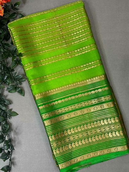 A vibrant parrot green pure Mysore silk saree with intricate golden zari weaving in a traditional Rangkat style.