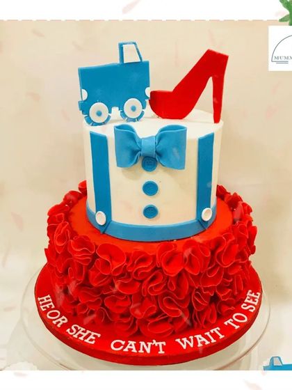 He or She? Can't wait to see! This fun gender reveal cake features a playful mix of a red stiletto and a blue truck, building excitement for the big announcement.