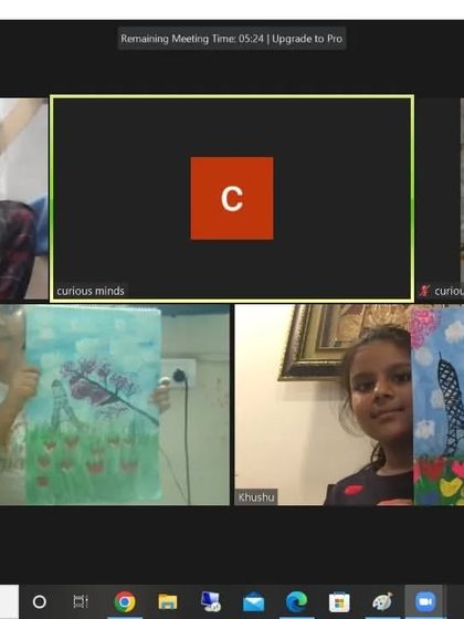 A screenshot of a lively online class, with multiple students showing their beautiful Eiffel Tower paintings. The sense of community is strong even online.