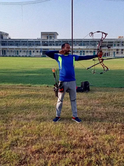 An archer takes aim with a compound bow during a practice session on our open field. I provide coaching that focuses on proper form, safety, and aiming techniques for both beginners and experienced archers.