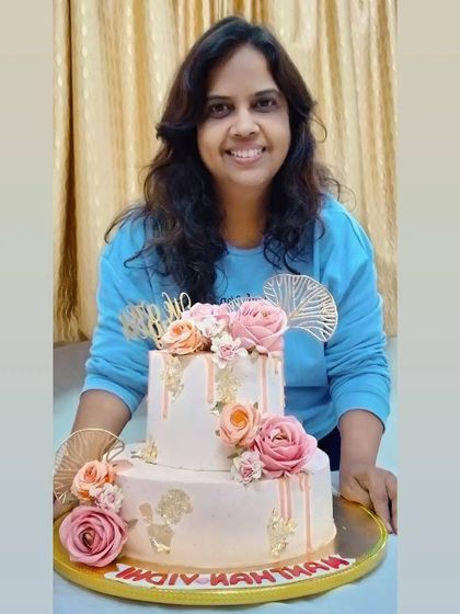 Me with the two-tiered pink engagement drip cake. It's always a pleasure to deliver these special creations.