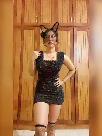 Posing in my black cat costume before my set. Themed events are a great opportunity to be creative with both music and style.