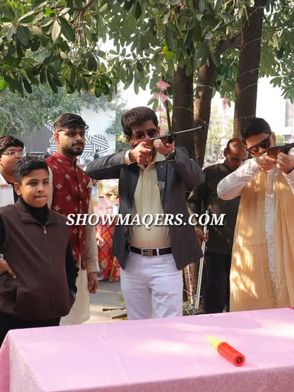 Guests having fun at a shooting gallery game stall, another one of the many activities we can arrange.