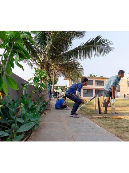 Young cricketers make use of the pathway edge at the Worli ground. Our designs for public spaces are robust, anticipating how people will adapt them for play and social interaction in both planned and spontaneous ways.