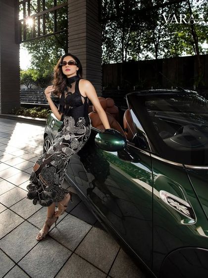 Styling for the cover of Varaa Bridal Magazine with the talented Ritu Varma. This look was all about modern glamour, pairing a unique black embroidered dress with a classic convertible for a chic, sophisticated shot.