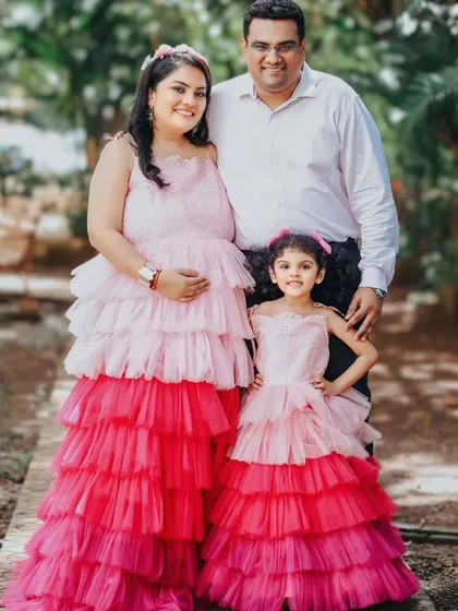 Create precious memories with our mom-and-daughter twinning sets. This fun, multi-layered pink and red tulle gown combination is perfect for celebrating a new arrival with the whole family.