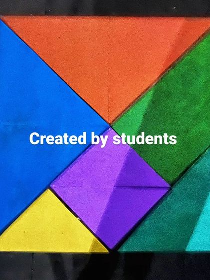 A top-down view of the colorful Tangram Table. This project is a perfect blend of math, design, and hands-on woodworking.