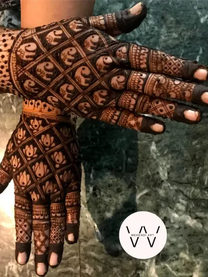 Celebrating a 25th wedding anniversary with this grand design, featuring a full jaal of elephants and lotuses.