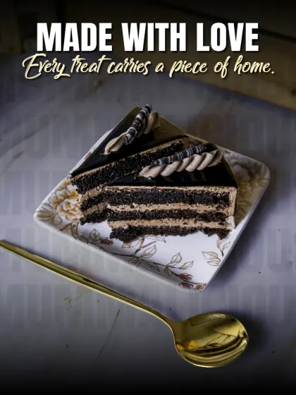 "Made with Love." A simple slice of our layered chocolate pastry, showing that every treat we make carries a piece of home.
