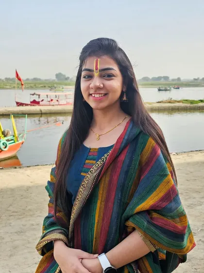 A peaceful moment by the holy river in Vrindavan, the place where my heart belongs. The tilak on my forehead is a symbol of this divine connection.