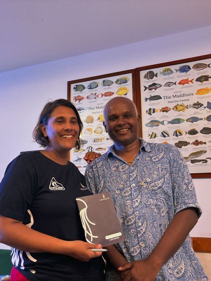 That proud moment of signing a logbook and officially becoming a certified diver. Here I am with a newly certified diver in the Maldives.