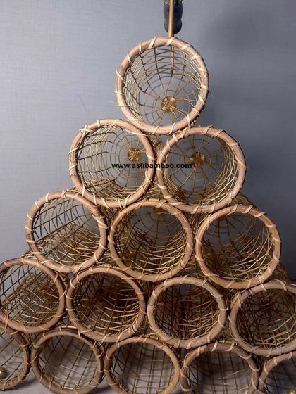 A larger version of our pyramid wine rack, capable of holding fifteen bottles. This freestanding piece is both a functional storage solution and a sculptural element for any wine lover's home.