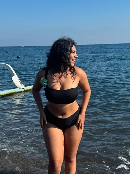 Another joyful moment in the water. My natural curls and genuine smile capture the carefree spirit of an island vacation.