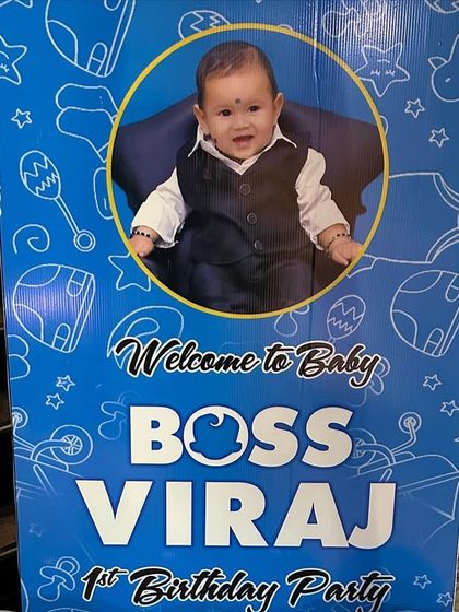 A close-up of a personalized 'Boss Baby' welcome sign. I can customize these signs with your child's photo and name to match any theme.