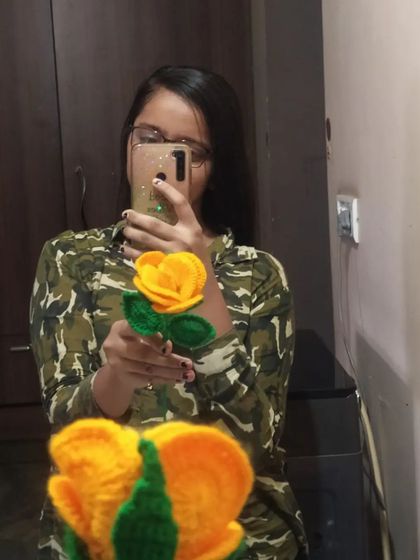 A mirror selfie with one of our yellow petal roses. We love experimenting with different styles and colors.
