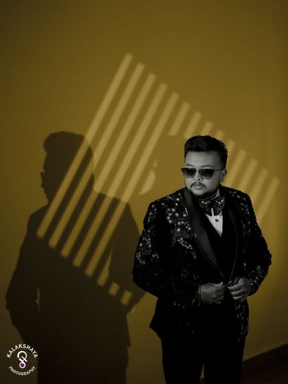 A creative black and white portrait of the groom, playing with shadows and light.