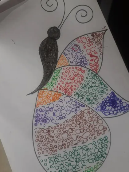 A finished piece from our art session, showing a beautifully detailed butterfly created with a doodling technique.