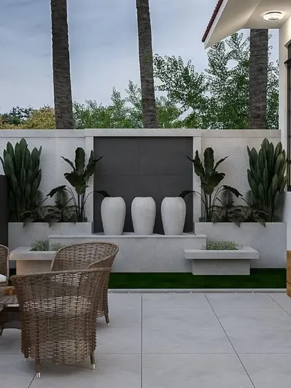 This render showcases the sitting area of the designed front verandah. It features comfortable wicker chairs, a water feature with decorative urns, and vertical planters, providing a green and relaxing escape from busy city life.