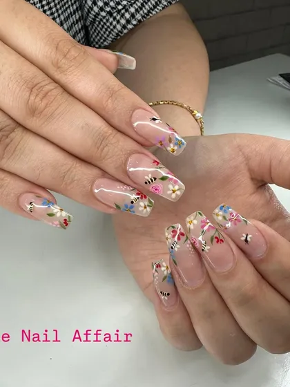 This design shows my passion for detailed hand-painting. On these long, clear square extensions, I created a delicate wildflower and bee pattern, giving the feel of a miniature garden on your nails.