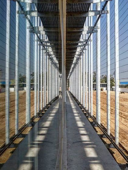 This is the space between the glass wall and the outer trellis at the ATE office. This interstitial zone is critical to the building's performance, creating a thermal buffer that significantly reduces cooling loads.