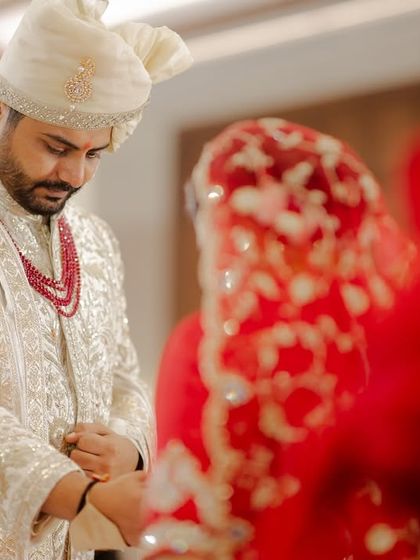 An intimate, close-up shot of the wedding rituals. We believe the beauty of a wedding is found in these small, significant details.