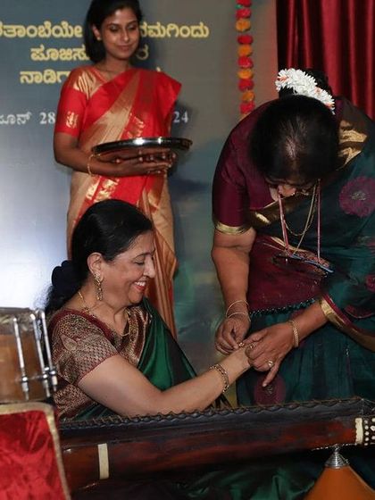 A guest honoring me on stage after a concert in Jaynagar. The love and respect from organizers and audiences mean the world to me.