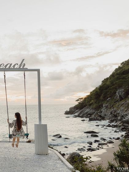 A solo portrait of the bride on the swing, capturing a moment of serene contemplation.