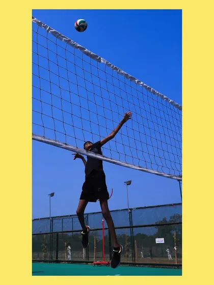 A player mid-air, executing a spike. This is the result of learning the right technique and approach.