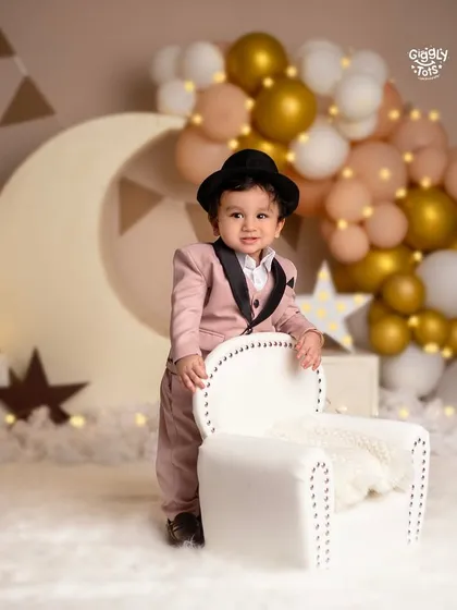 Your little one is the star of the show. This dapper first birthday setup with a moon and stars theme shows how we can celebrate your baby's big milestones in style.