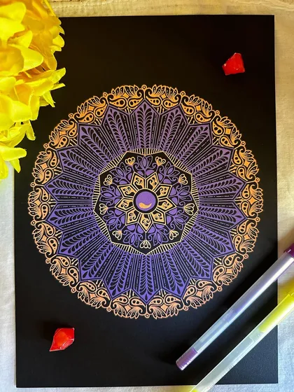 The combination of purple and gold on black paper feels so royal and elegant. This gelly roll mandala has a beautiful shimmer, with intricate patterns that catch the light and draw you in.