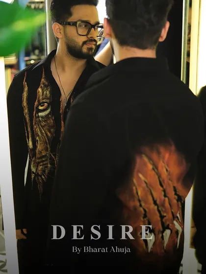 A reflection shot of the tiger-print shirt, showing both the front and back claw-mark details. This is a 360-degree statement piece.