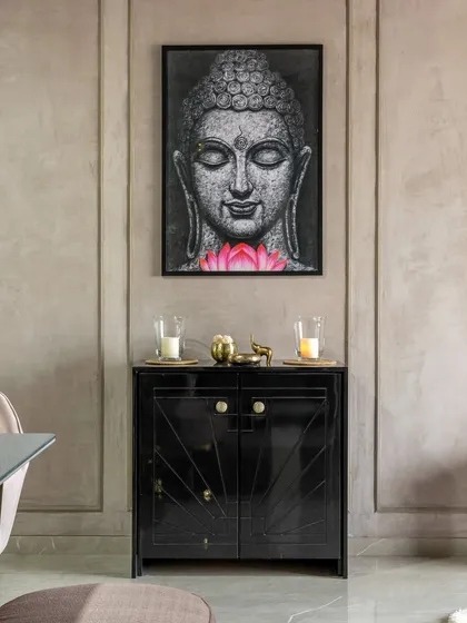 A serene corner in 'Maison-De-Confort', featuring a custom black console and a calming Buddha artwork. This space is designed for quiet reflection.