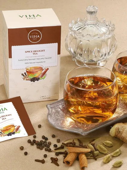 This lifestyle shot for Viha Teas showcases the 'Spice Delight' flavor in a warm, inviting setting. By including the packaging, a brewed cup, and the actual spices like cinnamon and ginger, we help customers connect with the product's natural ingredients and authentic taste.