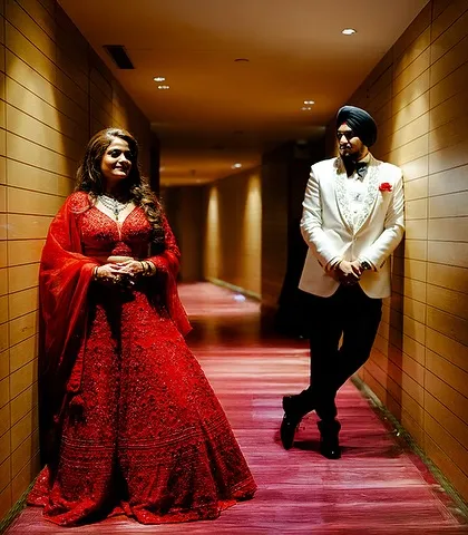 A creative portrait using the long hallway to create leading lines that draw the eye to the couple. A modern and stylish reception shot.