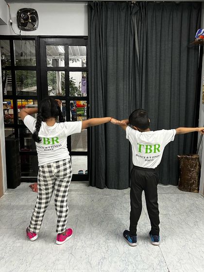 Showing off their studio pride. Our kids love wearing their Beat Room t-shirts and showing everyone they're part of the crew.
