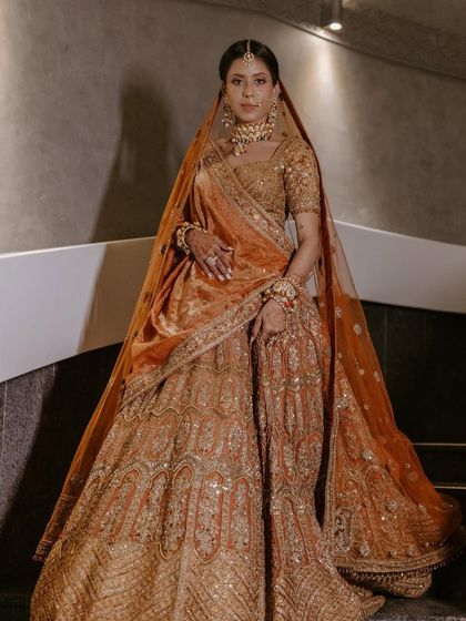 A full-length shot of the bride in her gorgeous Ejaaz Couture lehenga.