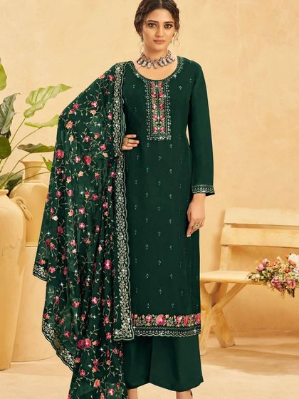 A deep bottle green salwar kameez for a look of pure elegance. The floral thread embroidery and sequins on the georgette fabric are perfect for an evening celebration.