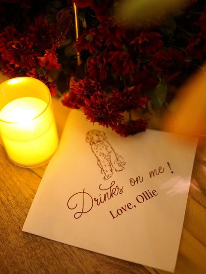 A personalized napkin from another event, this time with a cute doodle of "Ollie," the couple's dog.