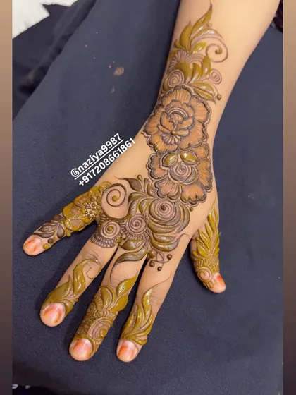 Another angle of the mixed floral design, showing how it covers the hand in a graceful, flowing pattern.