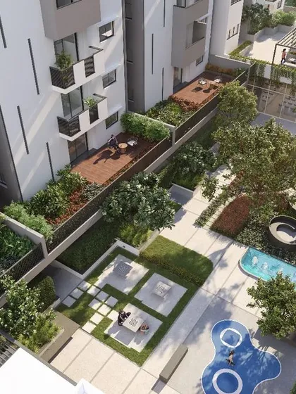 An aerial perspective of the Shilpa Ratna courtyard reveals the intricate planning involved in our urban landscapes. We layered private terraces, communal seating areas, water features, and children's play zones to create a dynamic and functional ecosystem for residents.