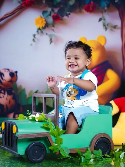 A happy, interactive moment captured during our fun-filled Winnie the Pooh photoshoot.