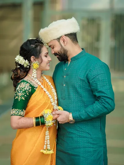 An intimate moment during a Maharashtrian pre-wedding ceremony. I focus on the quiet connections and traditional details that make your celebration unique, telling a story of love and heritage.