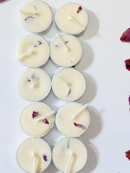 An overhead shot of my rose petal tealights, showing the consistent yet unique placement of petals in each hand-poured candle.