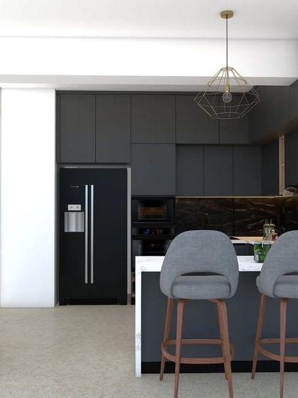 This view highlights the peninsula with comfortable bar seating, making the kitchen a social hub. The elegant geometric pendant light adds a modern artistic touch, perfectly complementing the sleek design of the cabinets and integrated appliances.