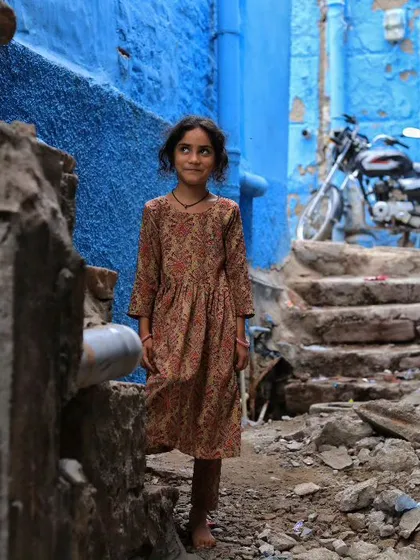 In the blue lanes of Jodhpur, I saw this young girl standing with a curious gaze. This shot is about more than just a portrait; it's about capturing a person within their environment, telling the story of a place through its people.