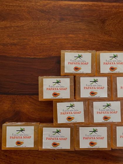 Getting a batch of my handmade Papaya soaps ready for a customer. I arrange them carefully to ensure they are perfect when they arrive.